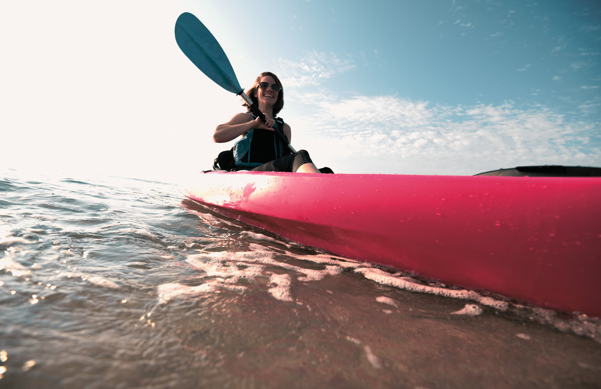 woman in a boat at laguna beach during addiction treatment