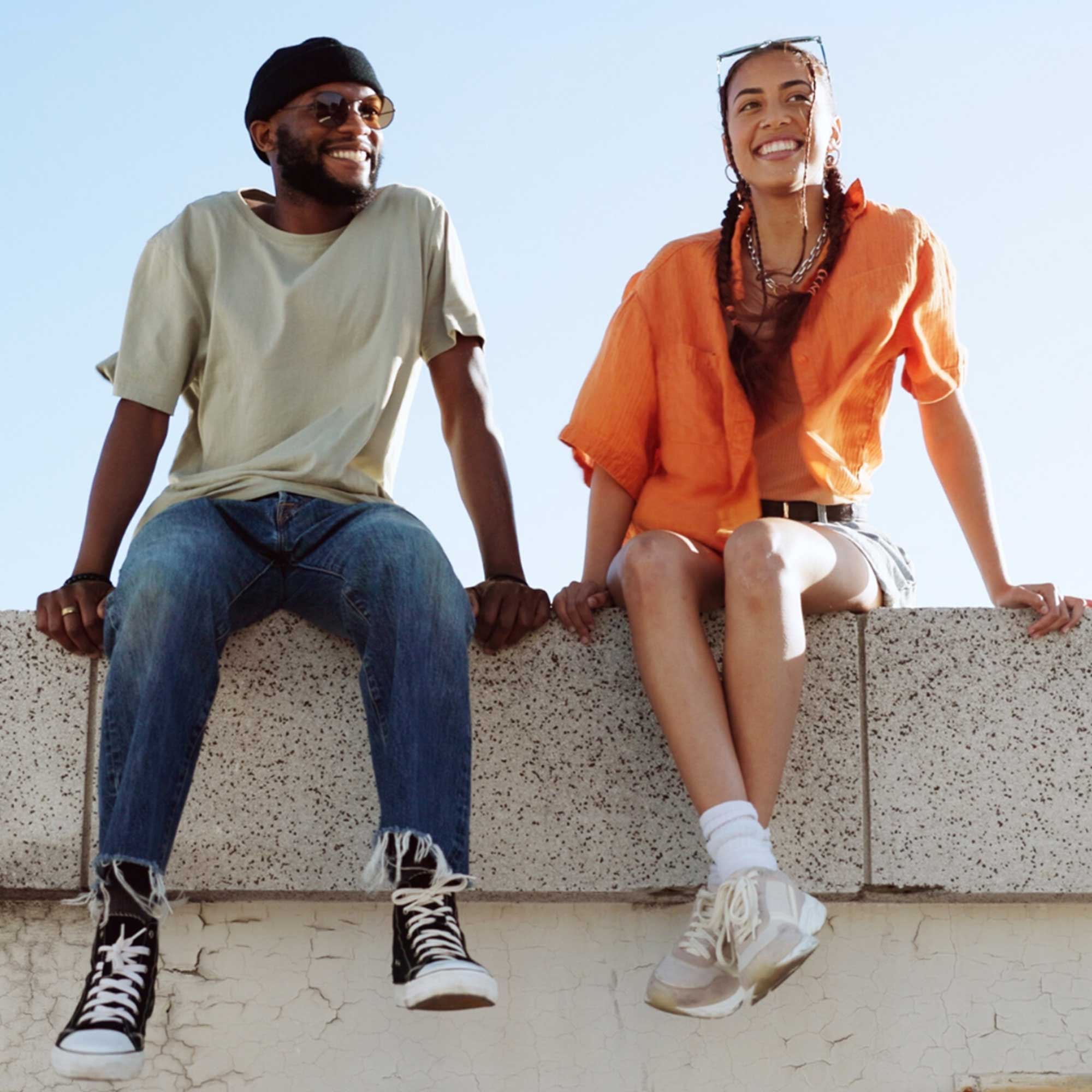 a young man and woman smiling outside of substance abuse treatment center